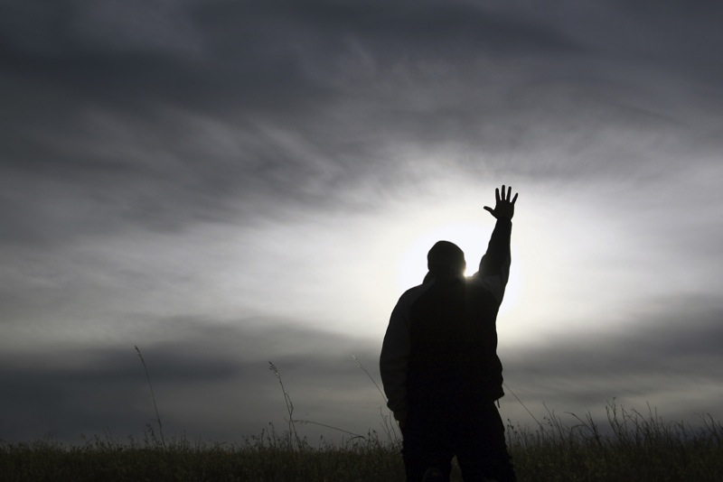 Man-Holding-one-hand-to-heaven